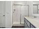 Bathroom featuring a glass enclosed shower, white quartz counters, and a sink at 7856 Magnolia St, New Palestine, IN 46163