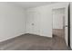 Carpeted bedroom with a closet and neutral walls, offering a calm retreat at 7856 Magnolia St, New Palestine, IN 46163
