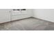 Bright bedroom with a snowy view, featuring neutral carpet and white walls at 7856 Magnolia St, New Palestine, IN 46163