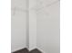 Walk-in closet with metal shelving and neutral carpet at 7856 Magnolia St, New Palestine, IN 46163