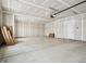 Spacious garage with a concrete floor, drywall, and garage door opener at 7856 Magnolia St, New Palestine, IN 46163