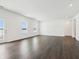 Open concept main living space features modern flooring and natural light at 7856 Magnolia St, New Palestine, IN 46163
