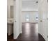 View of main living space from the powder room, leading to the back door at 7856 Magnolia St, New Palestine, IN 46163