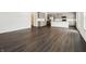 Open-concept living room featuring a spacious design, hardwood floors, and a modern kitchen at 7856 Magnolia St, New Palestine, IN 46163
