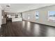 Open-concept living area featuring a spacious design, modern kitchen, and lots of natural light at 7856 Magnolia St, New Palestine, IN 46163