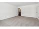 Bright main bedroom featuring neutral carpet, white walls, and an ensuite bathroom at 7856 Magnolia St, New Palestine, IN 46163