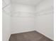 Spacious walk-in closet featuring carpet floors and white wire shelving at 7856 Magnolia St, New Palestine, IN 46163