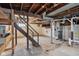 Unfinished basement with utilities and a staircase at 2161 Napoleon St, Indianapolis, IN 46203