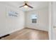 Charming bedroom featuring light wood floors and a window view at 2161 Napoleon St, Indianapolis, IN 46203