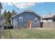 Gray detached garage with orange door in backyard at 2161 Napoleon St, Indianapolis, IN 46203