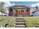 Gray house with brick front porch and steps, a welcoming entrance at 2161 Napoleon St, Indianapolis, IN 46203