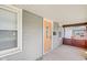 Covered porch with brick accents and an orange door at 2161 Napoleon St, Indianapolis, IN 46203