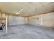 Large garage with overhead door and concrete floor at 2161 Napoleon St, Indianapolis, IN 46203