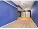 Large finished basement area with blue walls and carpet at 4729 Pearcrest Way, Greenwood, IN 46143