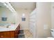 Bathroom with double vanity, tiled flooring, and shower at 4729 Pearcrest Way, Greenwood, IN 46143