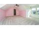 Bright bedroom with pink walls and ceiling fan at 4729 Pearcrest Way, Greenwood, IN 46143