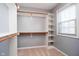 Spacious walk-in closet with custom shelving and rods at 4729 Pearcrest Way, Greenwood, IN 46143