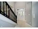 Bright entryway with tile flooring and a grand staircase at 4729 Pearcrest Way, Greenwood, IN 46143