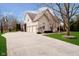 Three-car garage and expansive paved driveway at 4729 Pearcrest Way, Greenwood, IN 46143