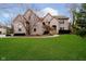 Brick two-story house with a large front lawn and driveway at 4729 Pearcrest Way, Greenwood, IN 46143
