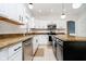 Bright kitchen with white cabinets, granite countertops, and subway tile backsplash at 4729 Pearcrest Way, Greenwood, IN 46143
