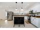 Modern kitchen with granite countertops, stainless steel appliances, and an island at 4729 Pearcrest Way, Greenwood, IN 46143