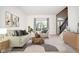 Bright living room features stylish furniture and large windows at 4729 Pearcrest Way, Greenwood, IN 46143