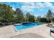 Inviting in-ground pool with concrete decking and spa at 4729 Pearcrest Way, Greenwood, IN 46143