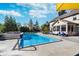 Relaxing in-ground pool with a spa and patio furniture at 4729 Pearcrest Way, Greenwood, IN 46143