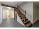 Basement stairs with access to a utility room with toilet and sink at 6470 Around The Hills Rd, Indianapolis, IN 46226