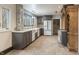 Modern kitchen featuring shaker cabinets, stainless steel appliances and a farmhouse sink at 6470 Around The Hills Rd, Indianapolis, IN 46226