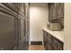 Spacious pantry with custom cabinets, lots of storage space, and tile floor at 6470 Around The Hills Rd, Indianapolis, IN 46226
