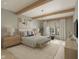 Serene main bedroom featuring exposed beams, neutral decor, and plenty of natural light at 1717 Beaufain St, Carmel, IN 46032