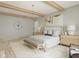 Relaxing main bedroom showcasing exposed beams, plush bedding, and ample space at 1717 Beaufain St, Carmel, IN 46032