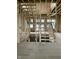 An unfinished staircase with exposed studs showcasing the home's construction progress at 1717 Beaufain St, Carmel, IN 46032