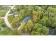 House nestled in a wooded lot, offering privacy at 4429 Village Dr, Anderson, IN 46012