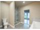 Modern bathroom featuring a large glass shower and grey tile at 4429 Village Dr, Anderson, IN 46012