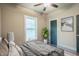 Bedroom with queen bed, window, and plant at 4429 Village Dr, Anderson, IN 46012