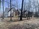 Two-story farmhouse with brick and white siding, gray roof, and attached garage at 4429 Village Dr, Anderson, IN 46012