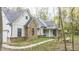White and brick farmhouse with gray roof and a walkway at 4429 Village Dr, Anderson, IN 46012