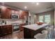 Updated kitchen featuring granite island and dark wood cabinetry at 4429 Village Dr, Anderson, IN 46012