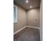 Laundry room with tile floor and window at 4429 Village Dr, Anderson, IN 46012