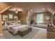 Spacious main bedroom with sitting area and natural light at 4429 Village Dr, Anderson, IN 46012