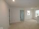 Bright bedroom with white walls, recessed lighting, and an open doorway at 5057 Modernist Blvd, Indianapolis, IN 46237