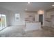 Bright kitchen featuring new white cabinets and sliding glass doors to the yard at 5057 Modernist Blvd, Indianapolis, IN 46237