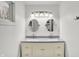Bathroom with double vanity and oval mirrors at 628 N Beville Ave, Indianapolis, IN 46201