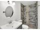 Modern bathroom with updated vanity, toilet and shower at 628 N Beville Ave, Indianapolis, IN 46201