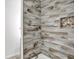 Shower with grey wood-look tile at 628 N Beville Ave, Indianapolis, IN 46201
