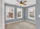 Bright bedroom with three windows and ceiling fan at 628 N Beville Ave, Indianapolis, IN 46201