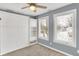 Bedroom with built-in shelving and ceiling fan at 628 N Beville Ave, Indianapolis, IN 46201